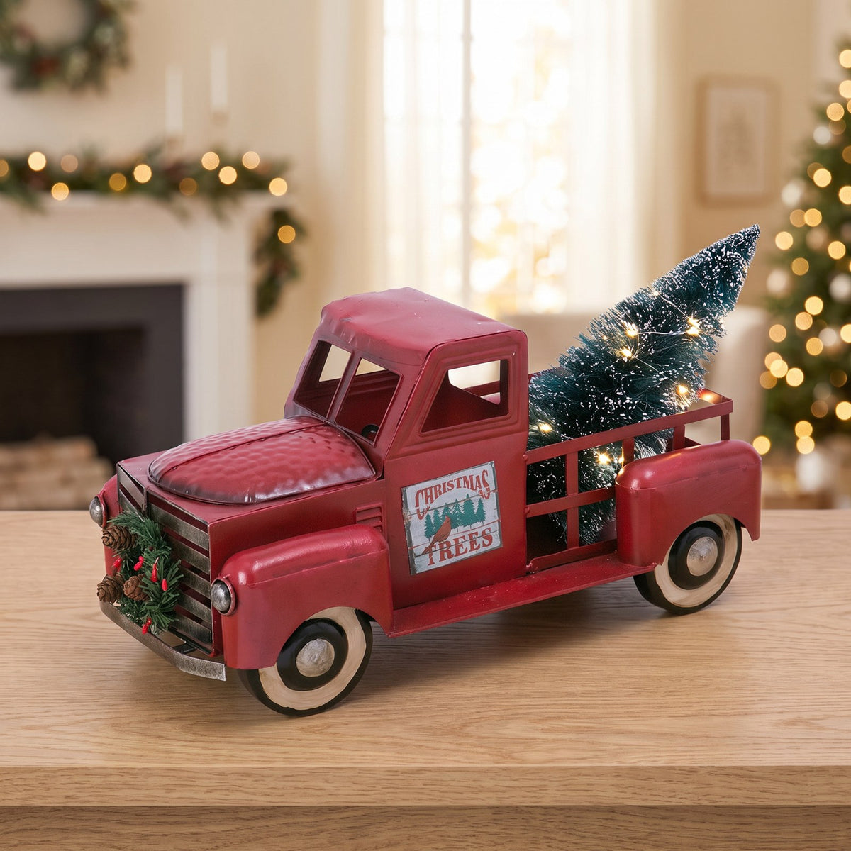 Gus's red metal truck with the bottlebrush tree lit in the bed.