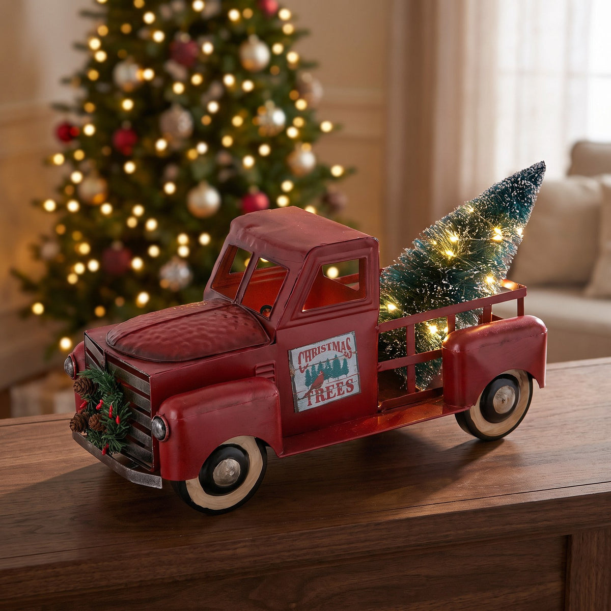 Gus's Christmas truck on a mantle with Christmas greens.